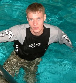 pool lifeguard swimming in uniform clothes